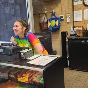 This girl was just a delight. Check that smile! Checking out the customers!