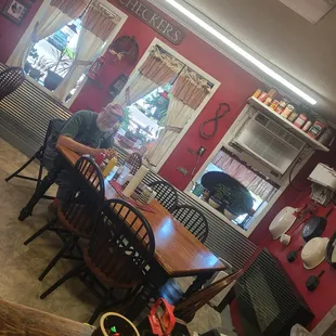 a dining room with red walls