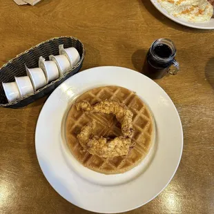 Chicken and waffles. Note the tiny mason jar with syrup