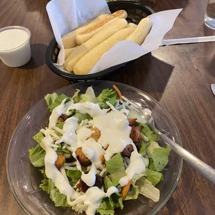 Side salad with ranch, breadsticks with ranch