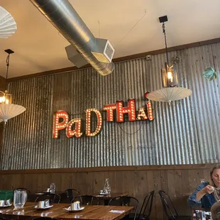 a woman sitting at a table in a restaurant