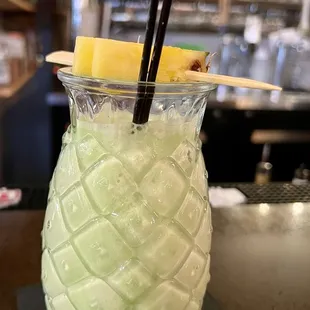 Coconut, pandan, and rum cocktail soothes the spicy food.