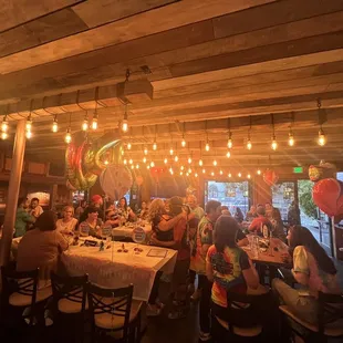 a large group of people sitting at a table