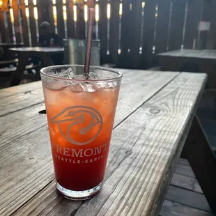 a drink on a picnic table