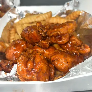Katie O's Chicken Bite Box, Tossed in our homemade Sweet BBQ sauce on a bed of seasoned fries!