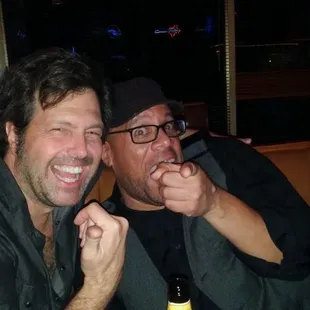 two men sitting at a table