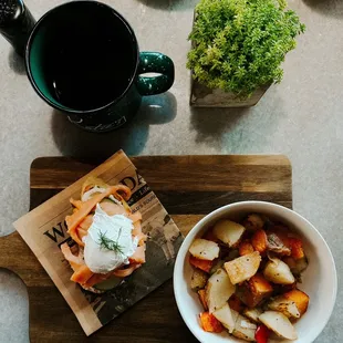 &quot;Lovely Lox&quot; - Chive cream cheese, thin sliced cucumber, smoked salmon, poached egg, and fresh dill with a side of their hash browns.