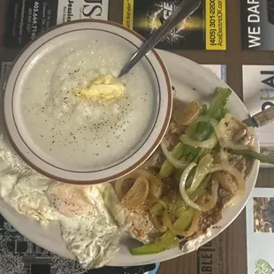 Pig chop, fried eggs &amp; grits.