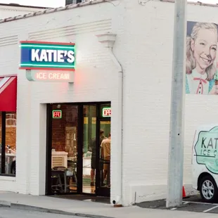 a van parked in front of the store