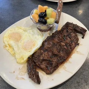 Fruit with eggs and steak