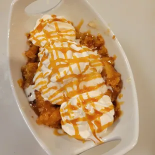 a plate of food with ice cream and caramel