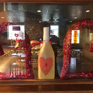 a window display of a bottle of wine