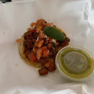 Pastor taco with green sauce