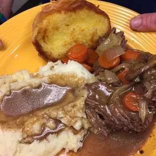 Homemade pot roast with roasted veggies and creamy mashed potatoes