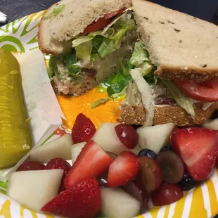 Chicken salad sandwich on rye with a side of fresh fruit - delish!