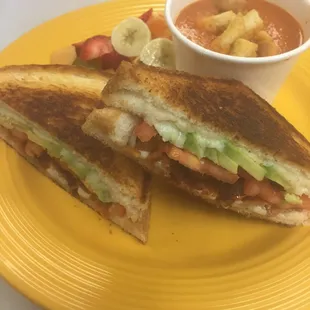 Grilled cheese with bacon,tomatoes and avocado with fresh fruit salad and a cup of home made tomato bisque. $6.95