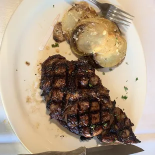 steak, potatoes, and a knife