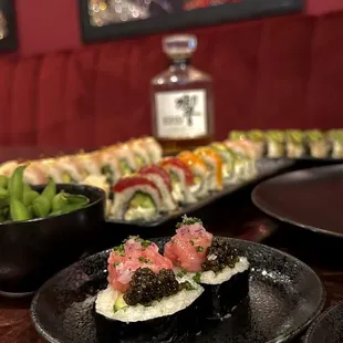 sushi on a black plate