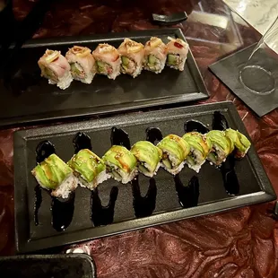 two plates of sushi on a table