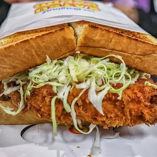 a chicken sandwich with coleslaw