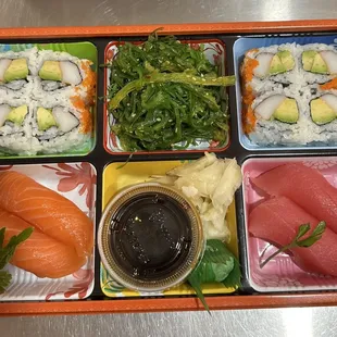 sushi roll and Nigiri box with salad