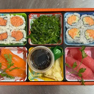 sushi roll and Nigiri box with salad