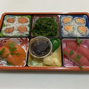 sushi roll and Nigiri box with salad