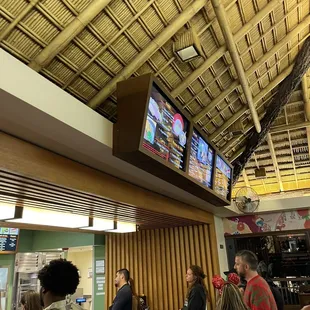 people watching tvs in a restaurant