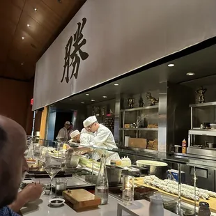 The sushi chefs at work but they were fun to chat with.