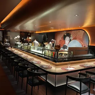 a sushi restaurant with a long counter