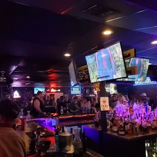 people watching tvs at the bar