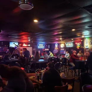 a crowd of people in a bar