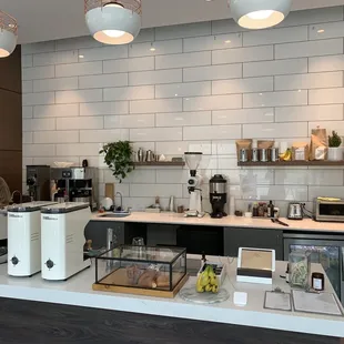 a coffee shop counter with a variety of items