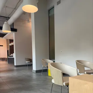 Inside area. Lots of lower seating and tables.