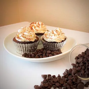 a plate of cupcakes and chocolate chips