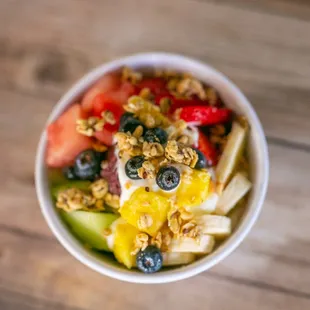 a bowl of fruit and granola