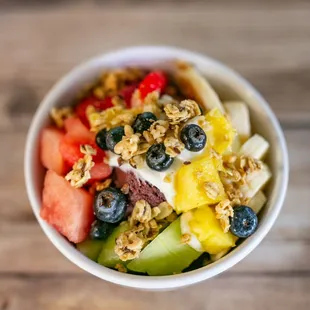 a bowl of fruit and granola