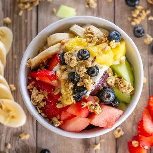 a bowl of fruit and granola