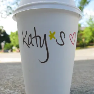 Katy writes her &quot;logo&quot; on every cup by HAND!