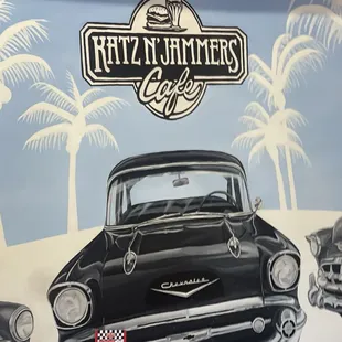 The inside business name on the wall so beautiful 50s car, very clean cafe.