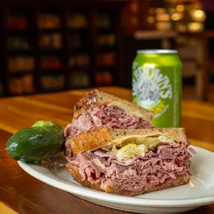 a corned beef sandwich with pickles