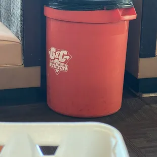 Garbage can in the middle of the tables