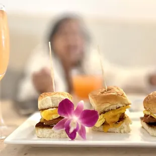 P.O.G. mimosa and Brunch Sliders (vegan Omnipork, scrambled egg, cheddar on a sweet Hawaiian roll)