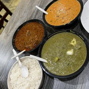 Goat dish (not sure of the name),palak paneer (green) and chicken tikka masala with rice.