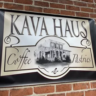 a sign on a brick wall