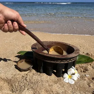 a bowl of food on the beach