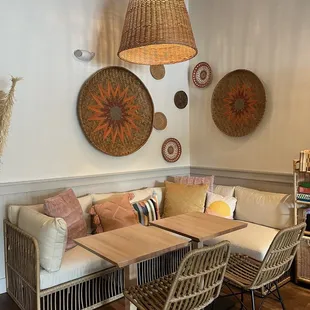 a living room with wicker furniture