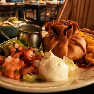 Chicken Chimichanga: fried flour tortilla stuffed with shredded chicken and Mexican cheese ($21).