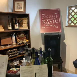 a display of wine bottles and menus