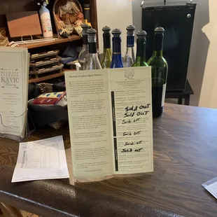 a table with wine bottles and menus